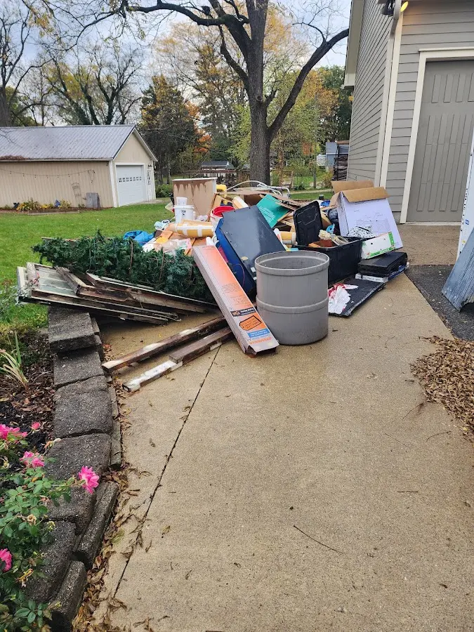 Dumpster being loaded with debris for Estate Cleanout Dumpster Rental in Upper Pottsgrove